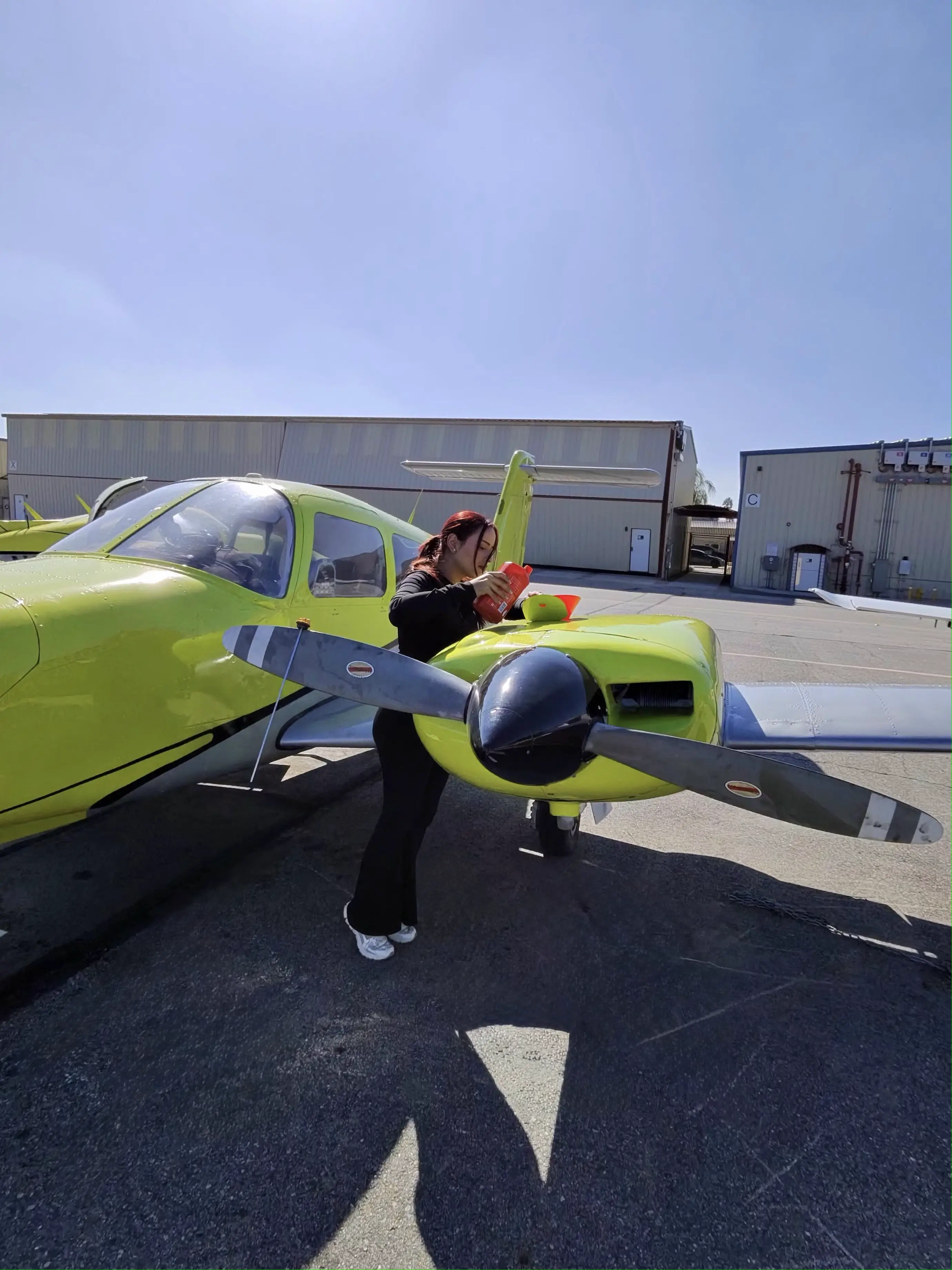 Essence ground crew fueling Cessna 162 and Piper Warrior at VNY