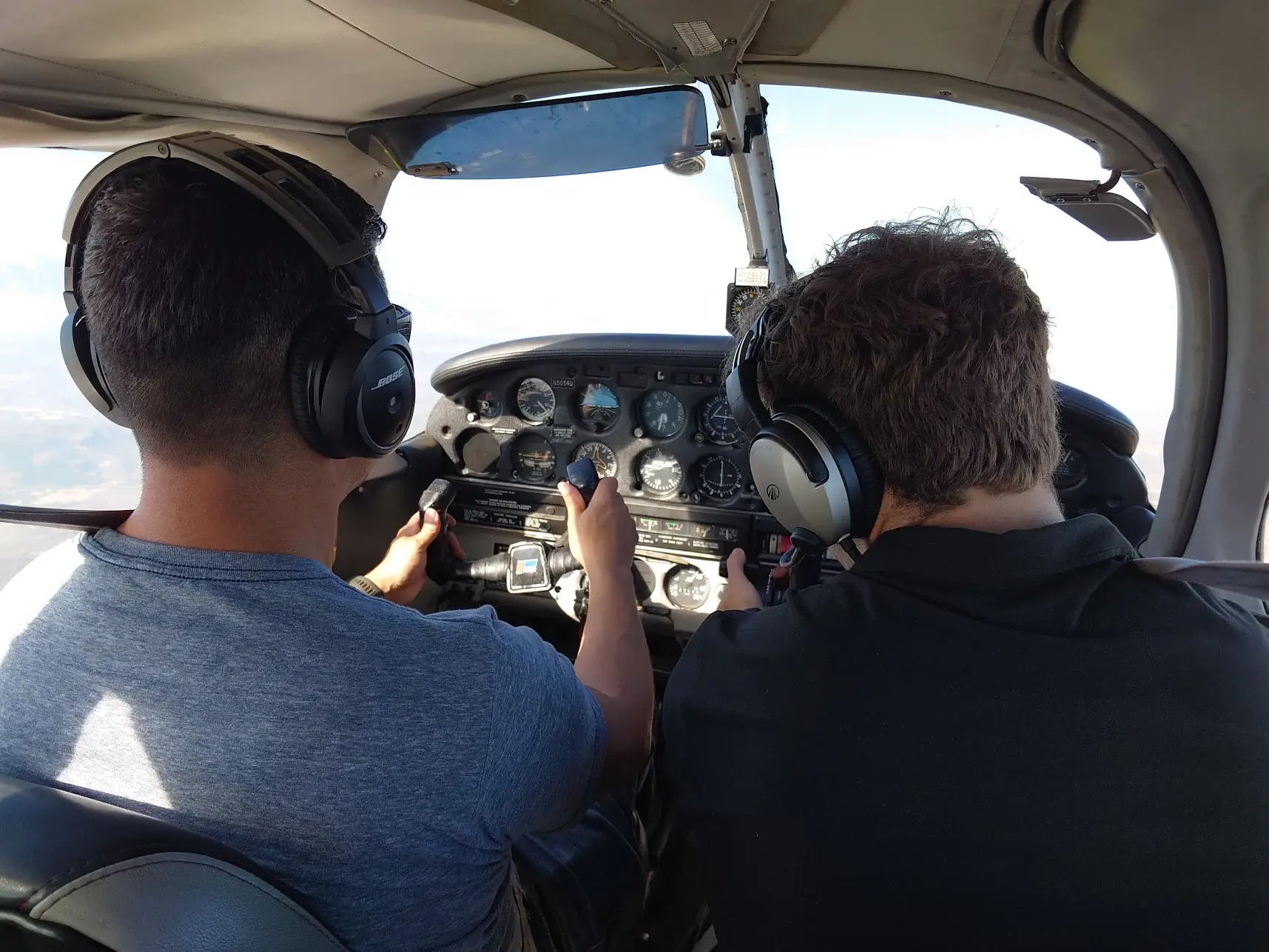 Students at Essence Flight School in Van Nuys Airport learning to fly in a Piper Archer cockpit